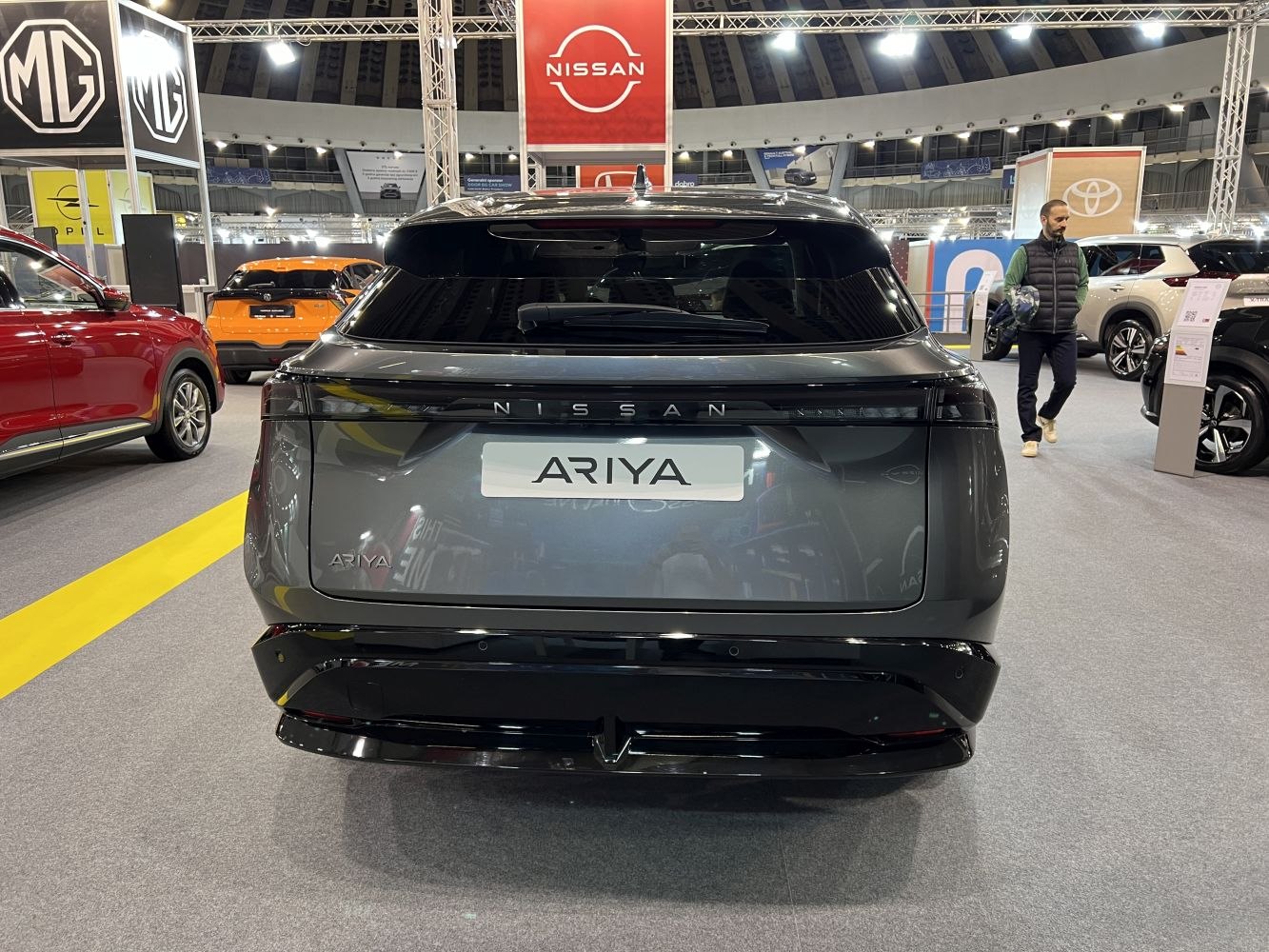 Rear view of modern electric SUV with sleek tail lights and hatch.