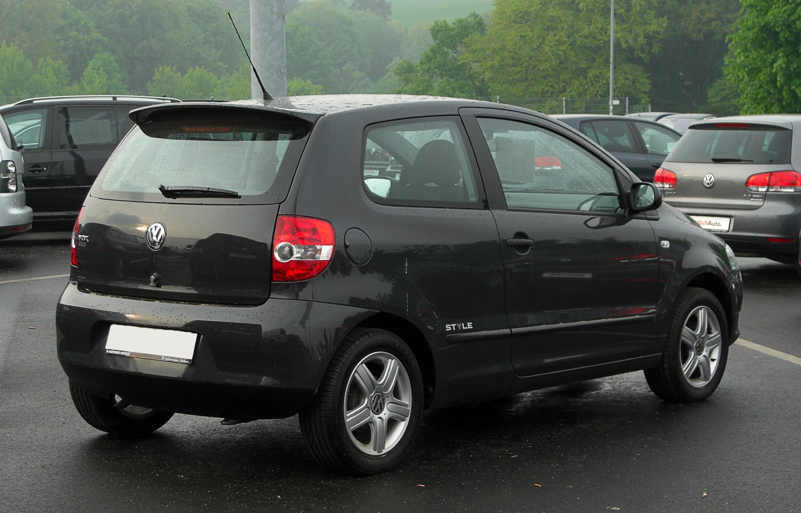 3-door hatchback rear view with alloy wheels and taillights