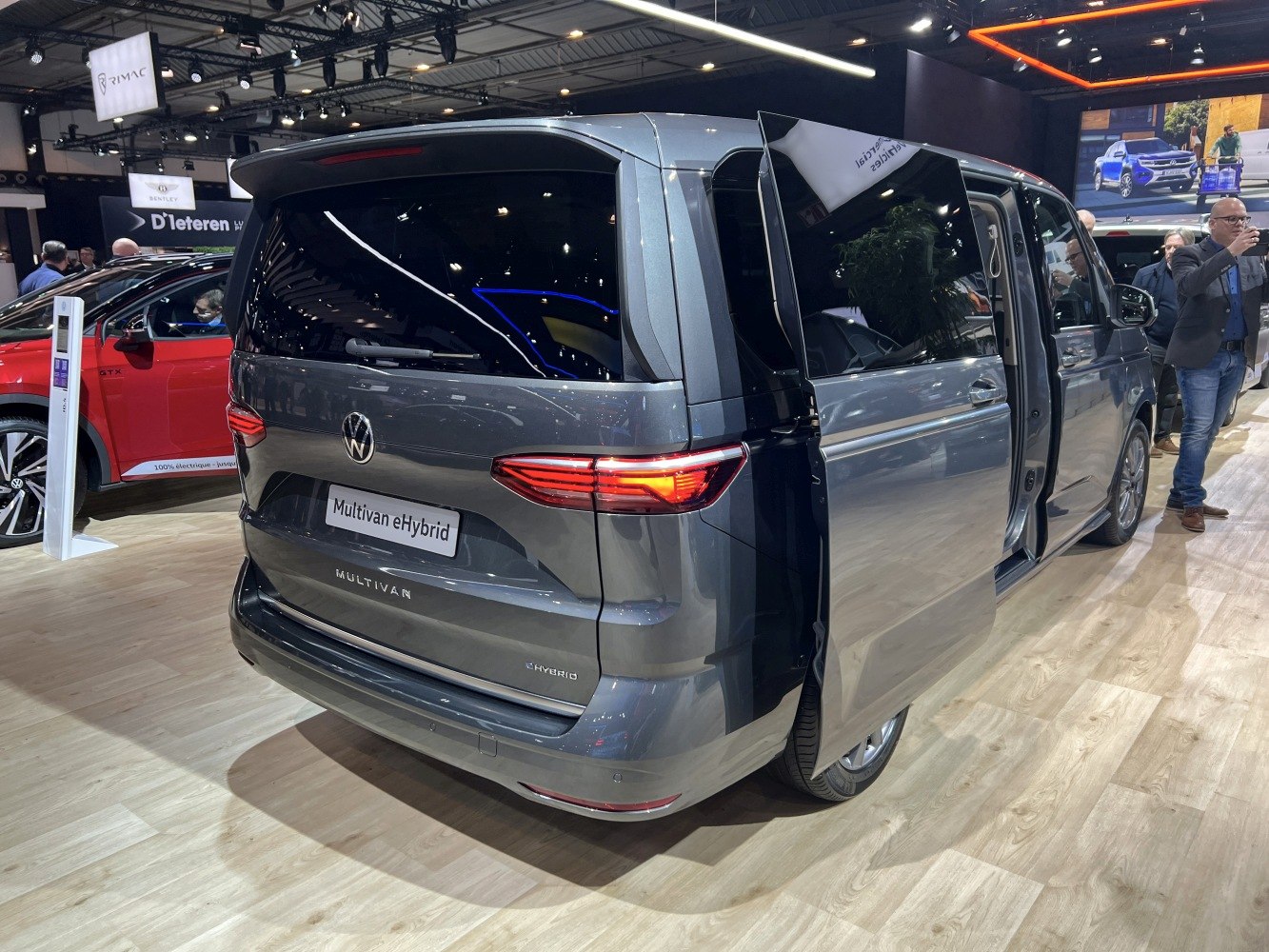 Rear and side view with open sliding door of a modern van.