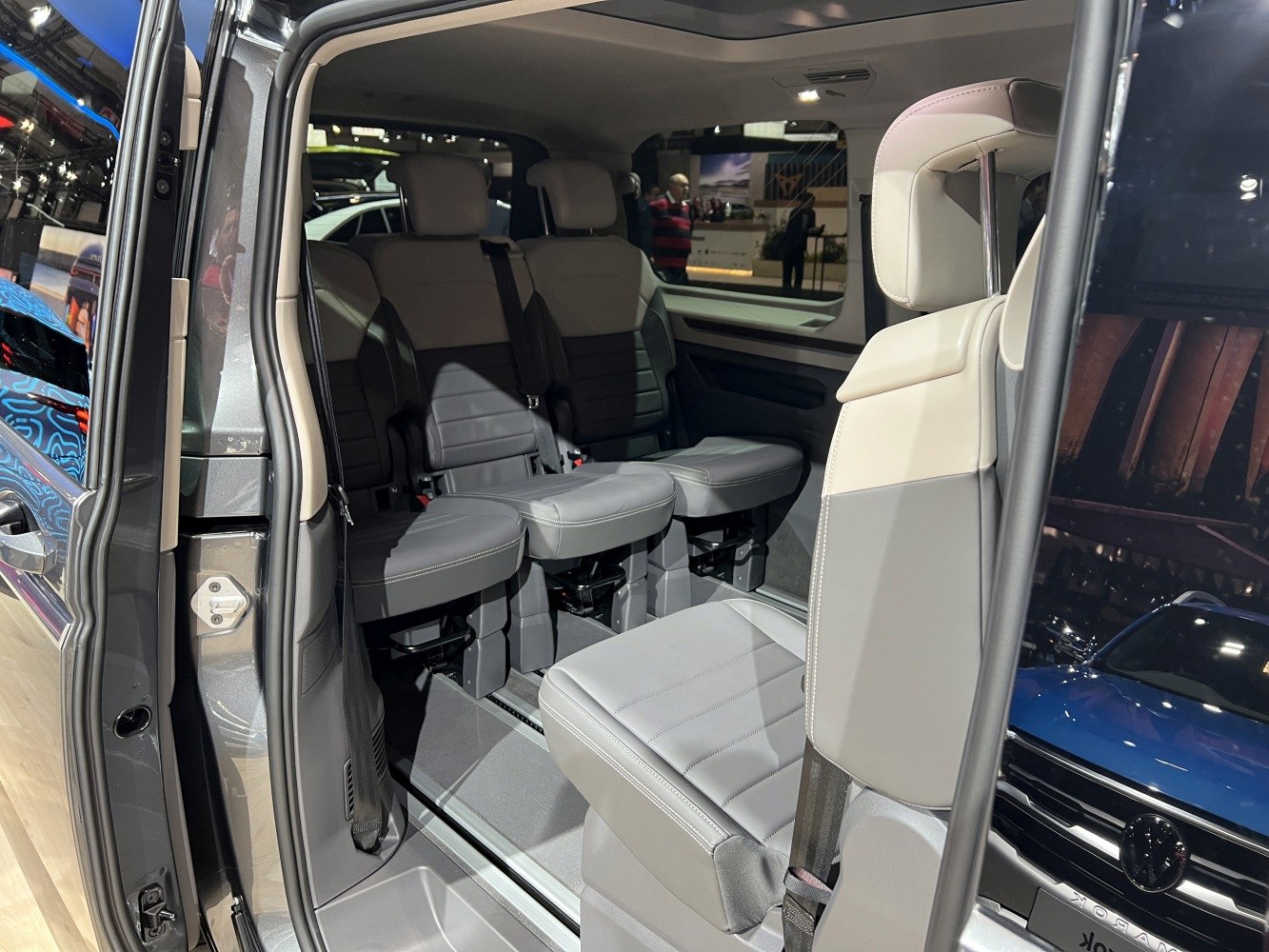 Flexible and spacious interior seating with multiple adjustable seats in a van.