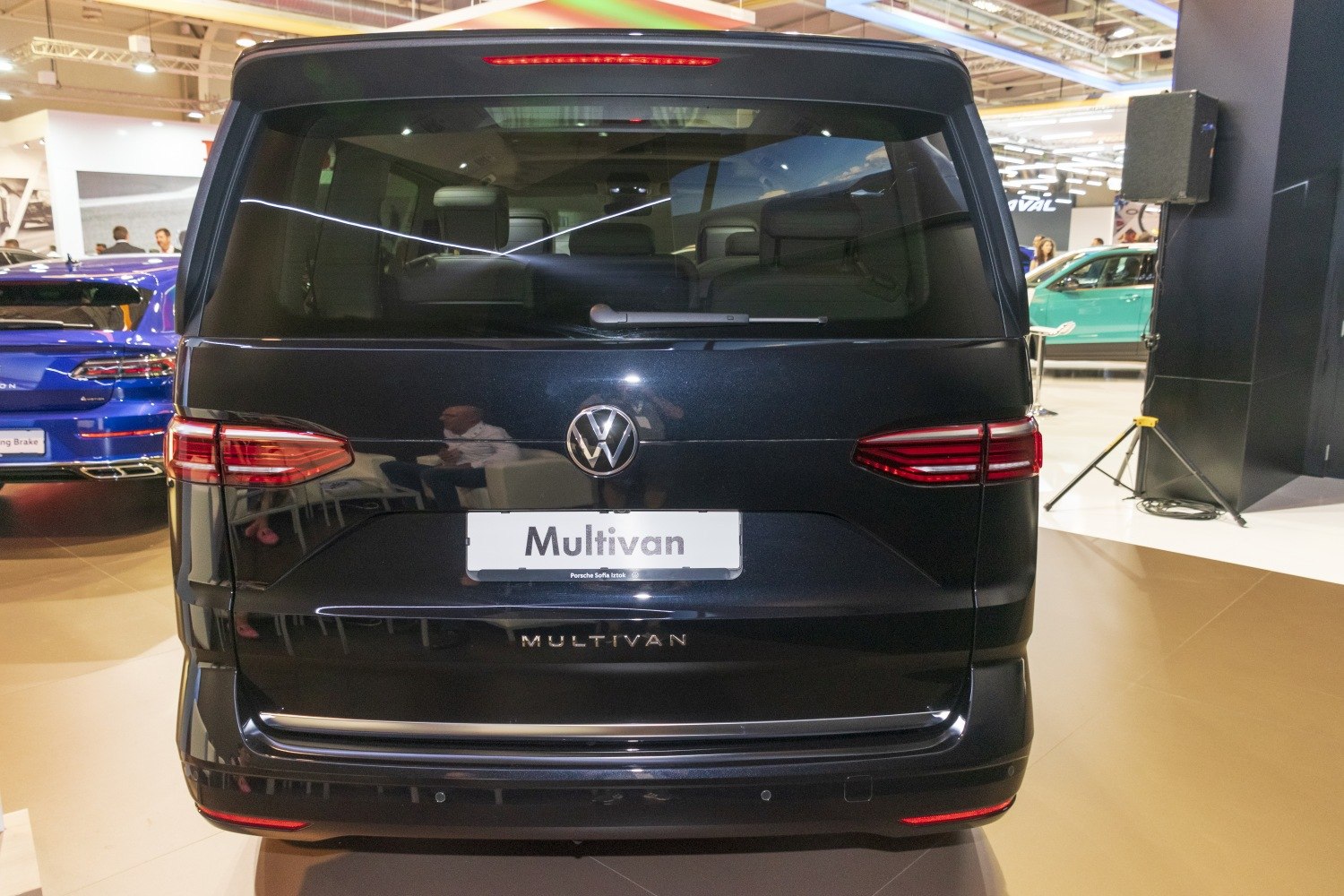 Sleek rear view of van with LED tail lights and large rear window