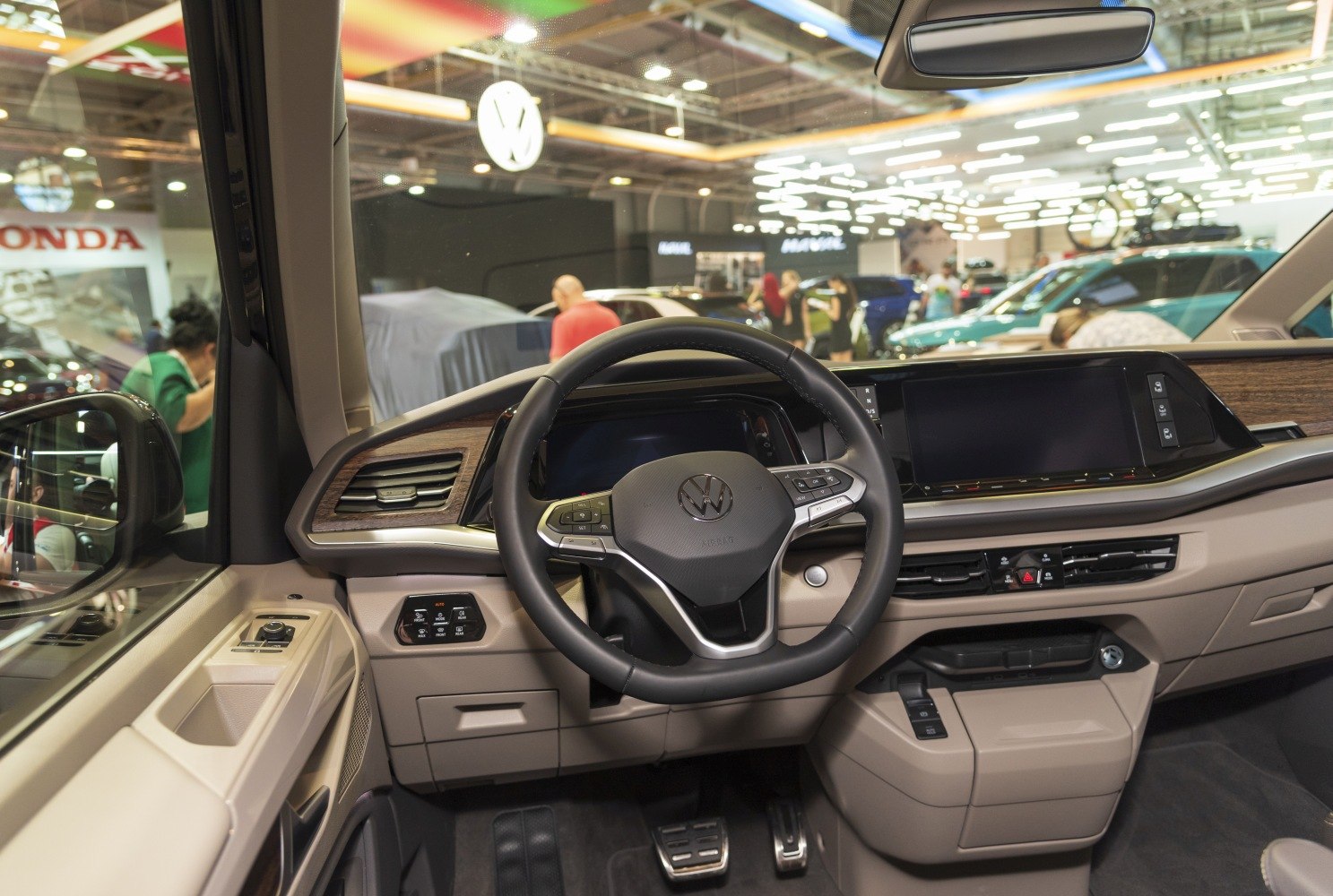 Steering wheel and dashboard with digital displays in beige interior