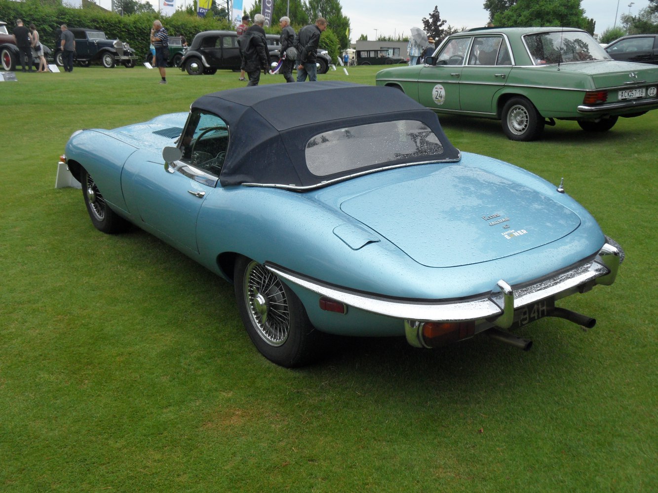 Rear view of Jaguar E-type Convertible with soft top and wire wheels