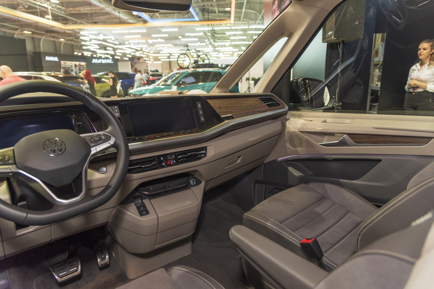 Modern dashboard and steering wheel with touchscreen and wood trim