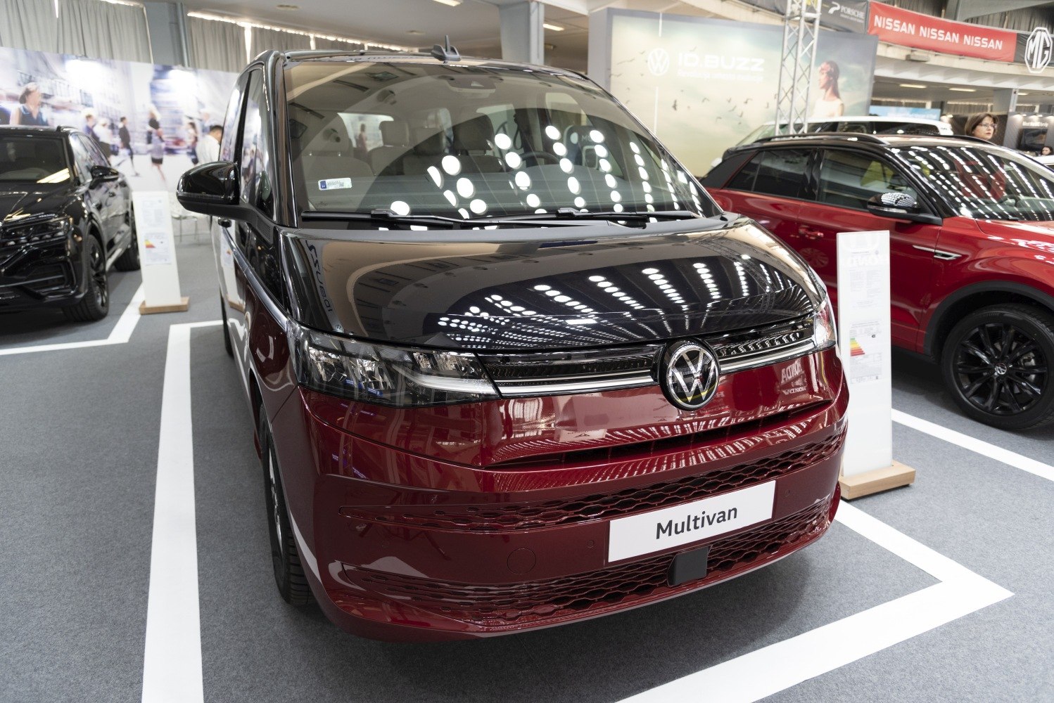 Front view of two-tone modern minivan with sleek LED headlights