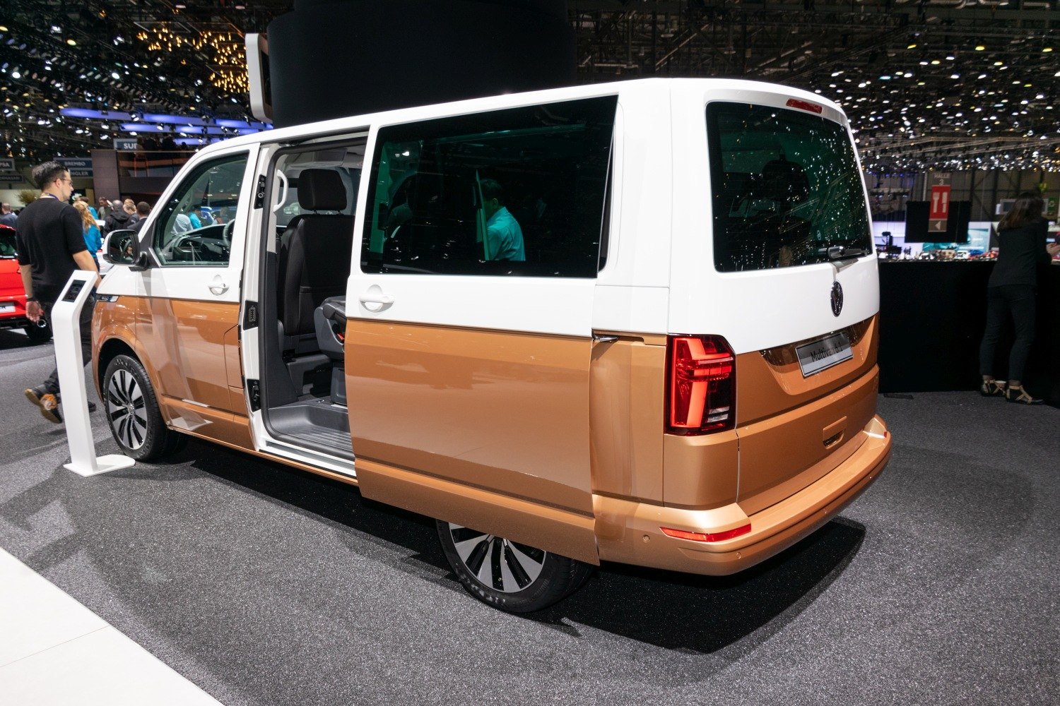 Rear side view with open sliding door and modern tail lights