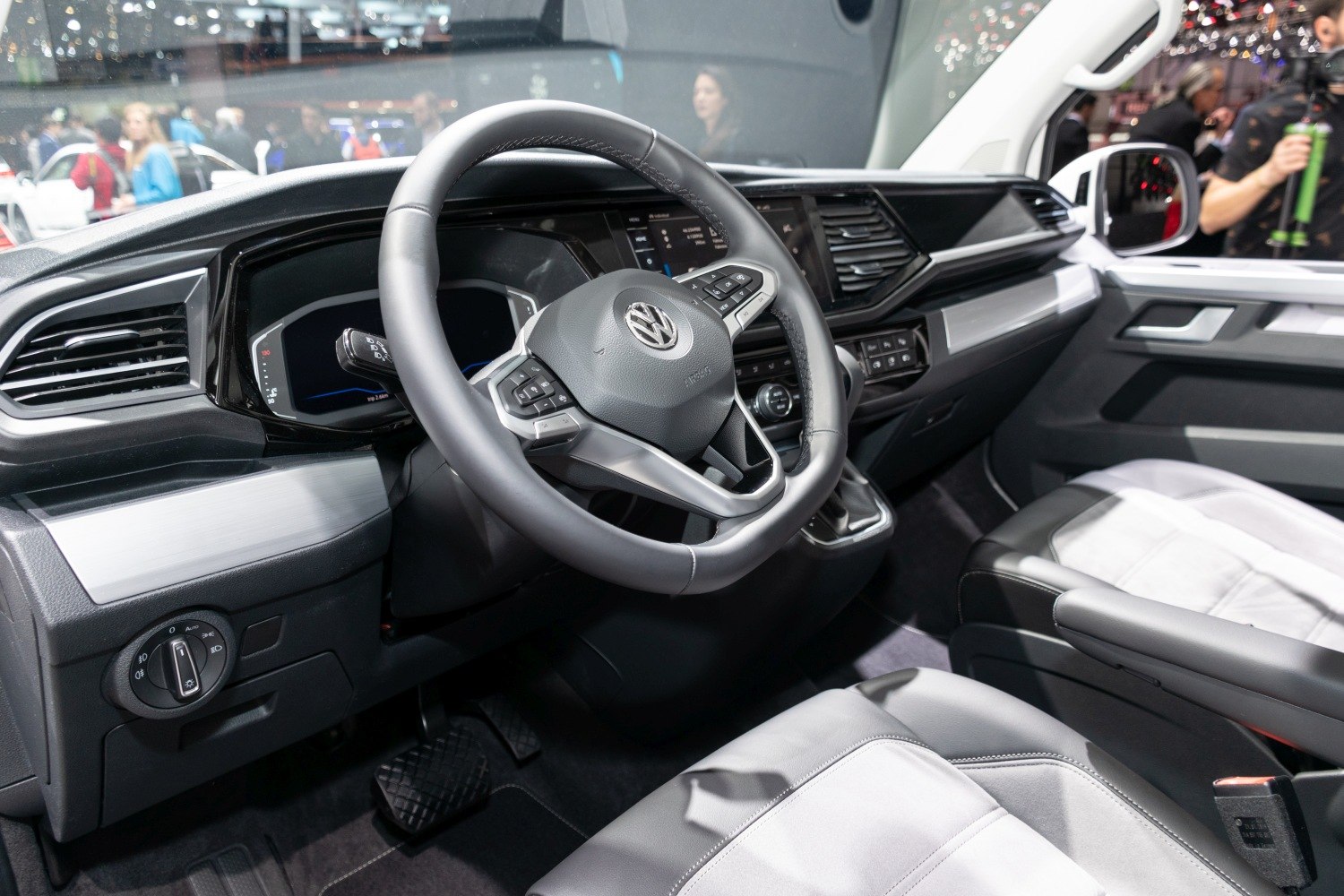 Multifunction steering wheel and digital dashboard in a vehicle interior