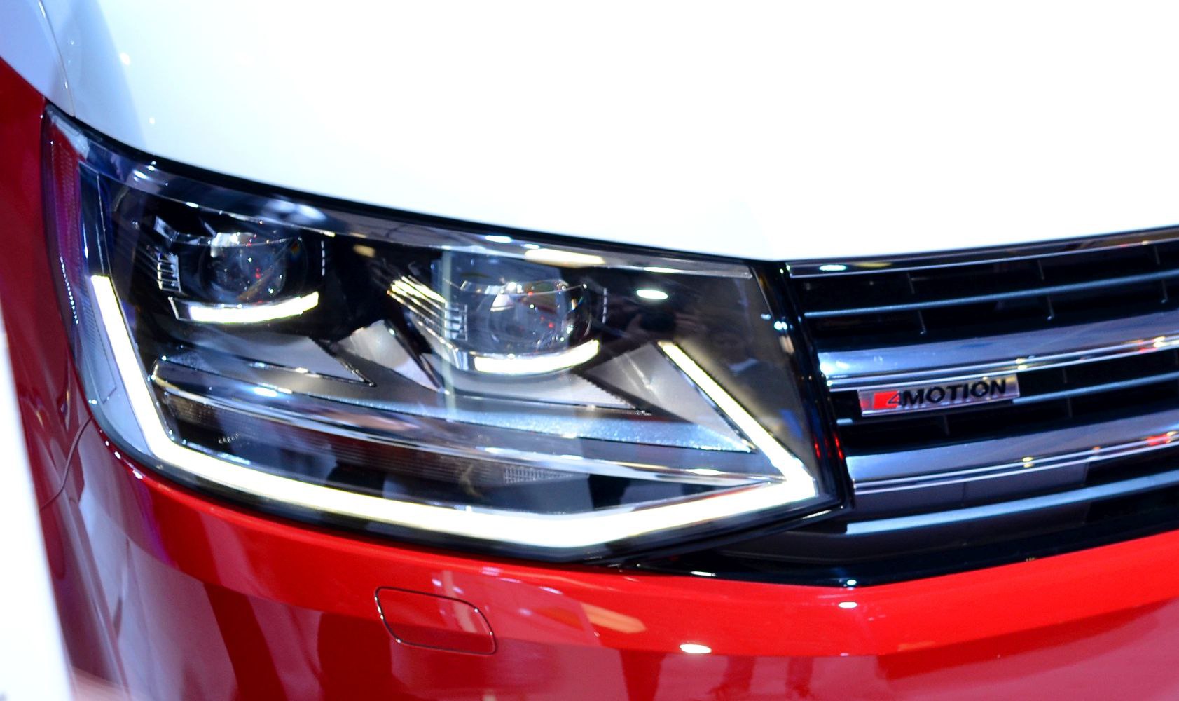 Close-up LED headlight and 4Motion badge on front grille