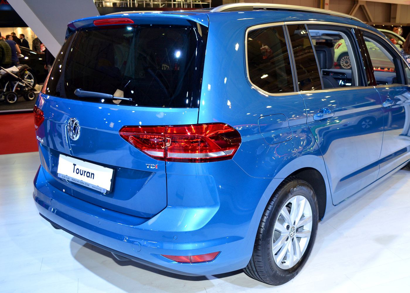 Rear and side exterior view with taillights and alloy wheels