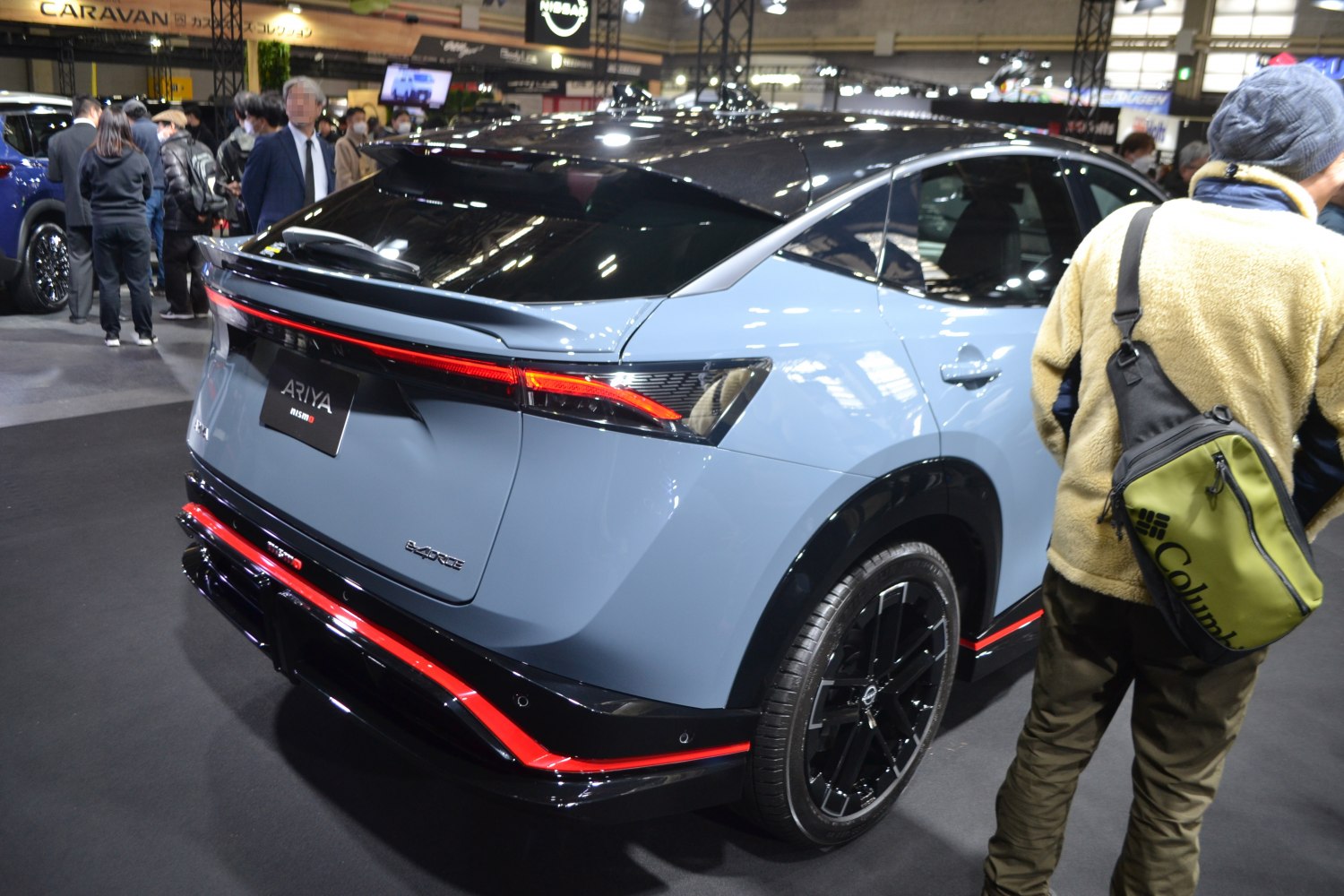 Sleek rear and side design with black roof, red accents, and modern taillights.
