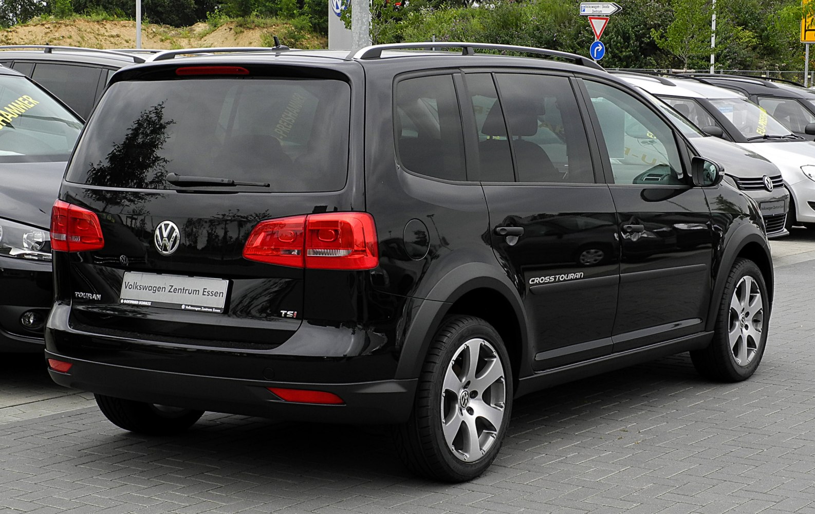 Rear view of black SUV with taillights and alloy wheels