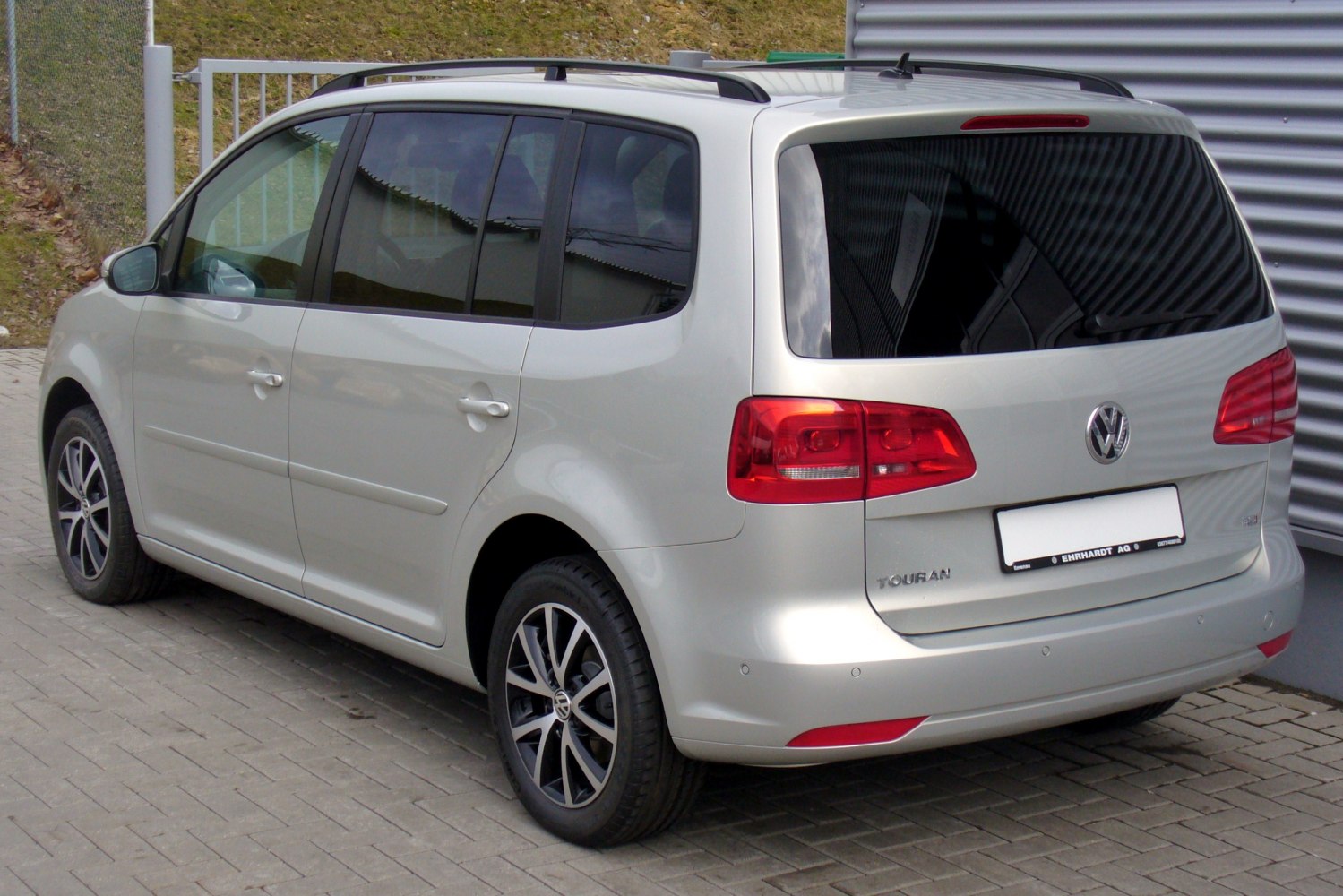 Rear side view with alloy wheels and tinted windows