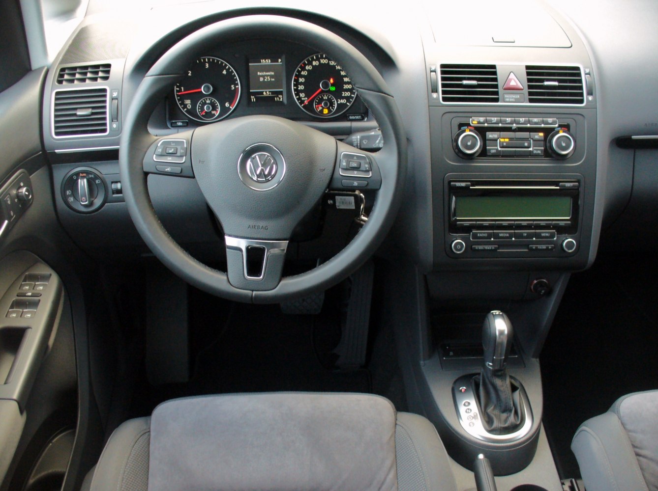 Dashboard and steering wheel with gear shift and controls
