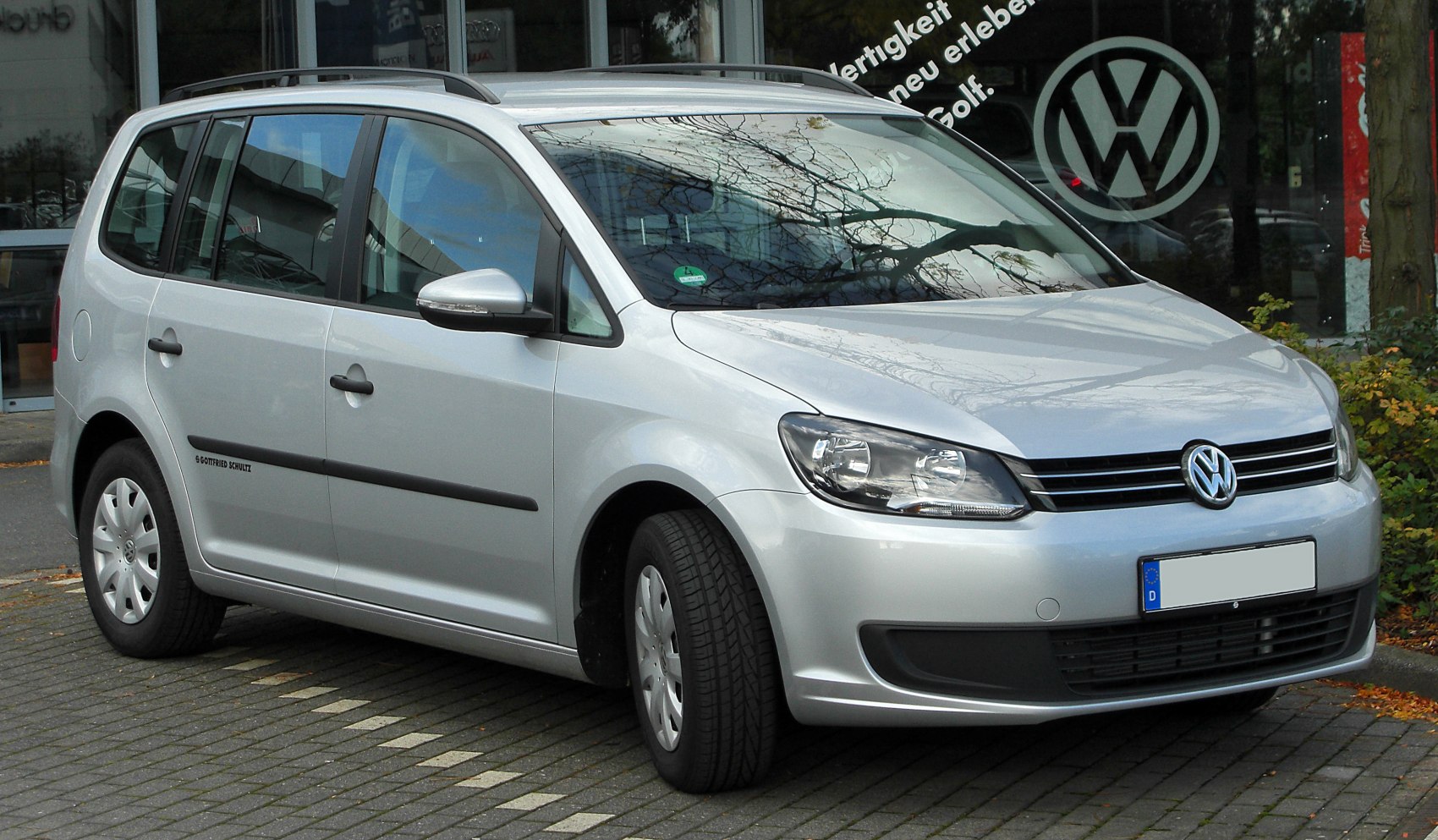 Silver MPV with front grille and headlights