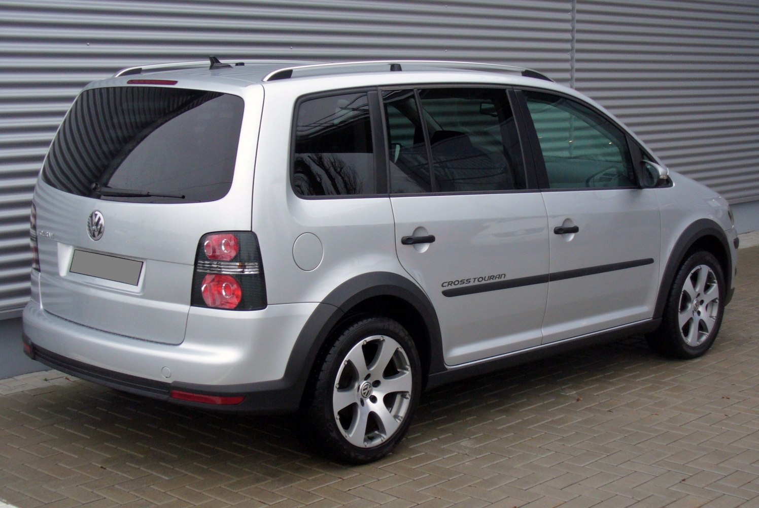 Silver compact MPV with roof rails and alloy wheels
