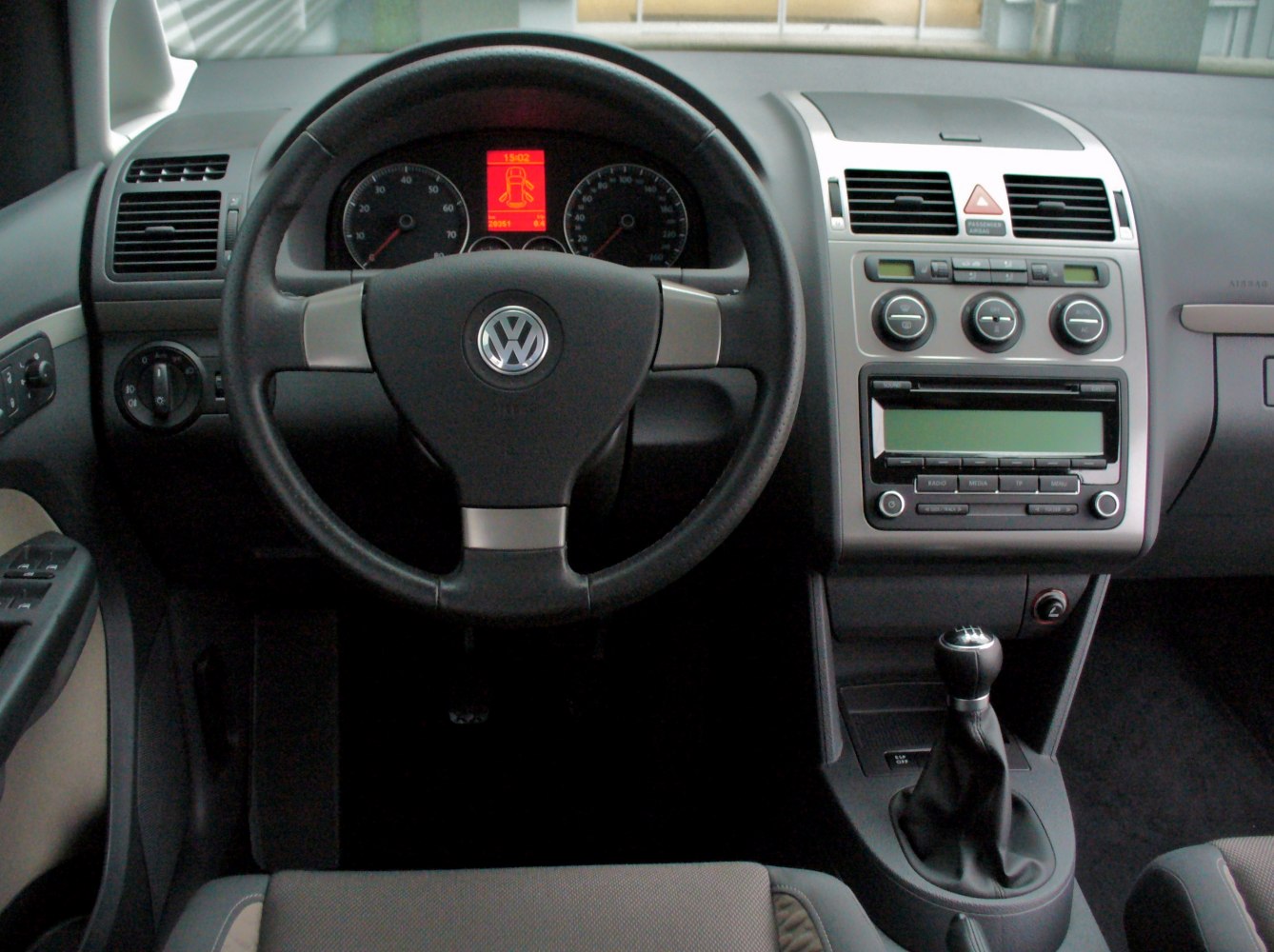 Dashboard and steering wheel with manual gear shift in car interior