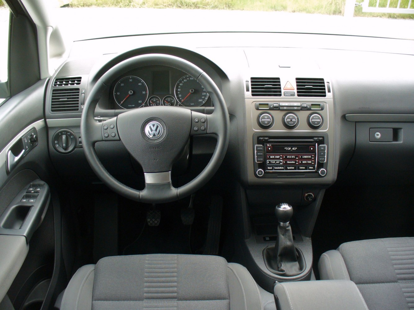 Dashboard and center console with manual gear shift and steering wheel