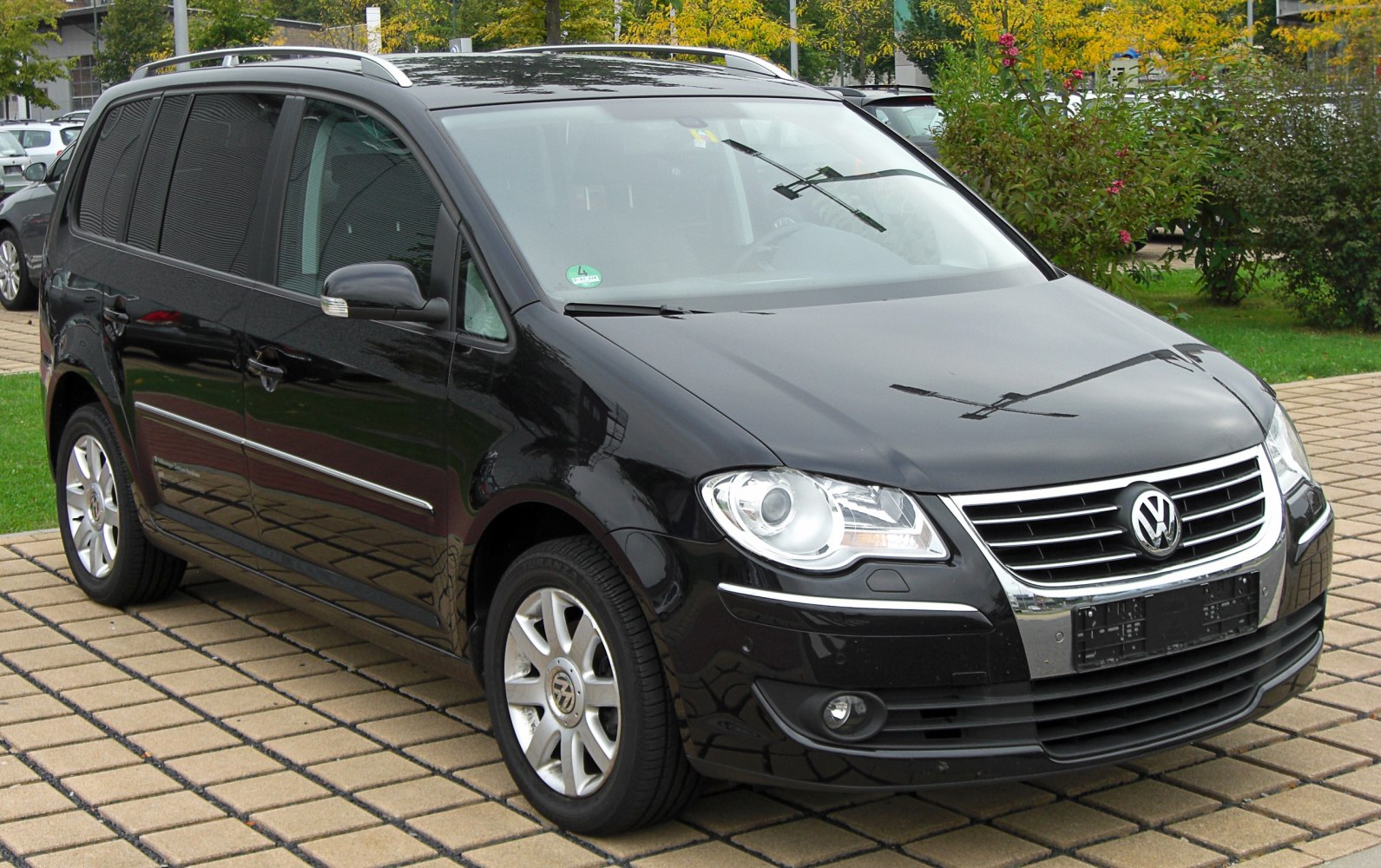 Front and side exterior with headlights and alloy wheels.