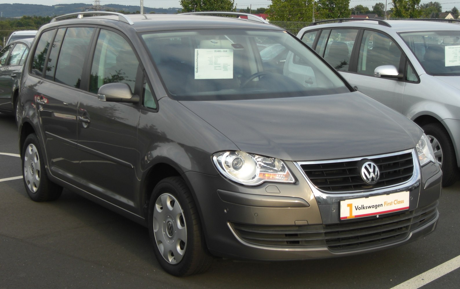 Grey multi-purpose vehicle front and side exterior