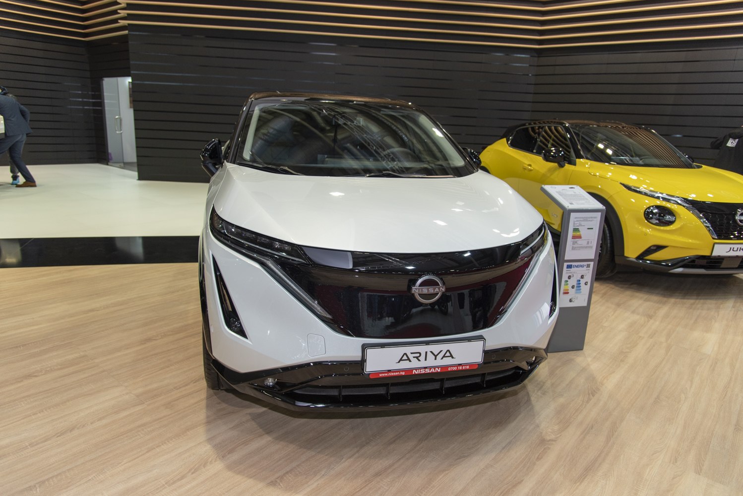 Front view of a sleek electric SUV with LED headlights and aerodynamic design