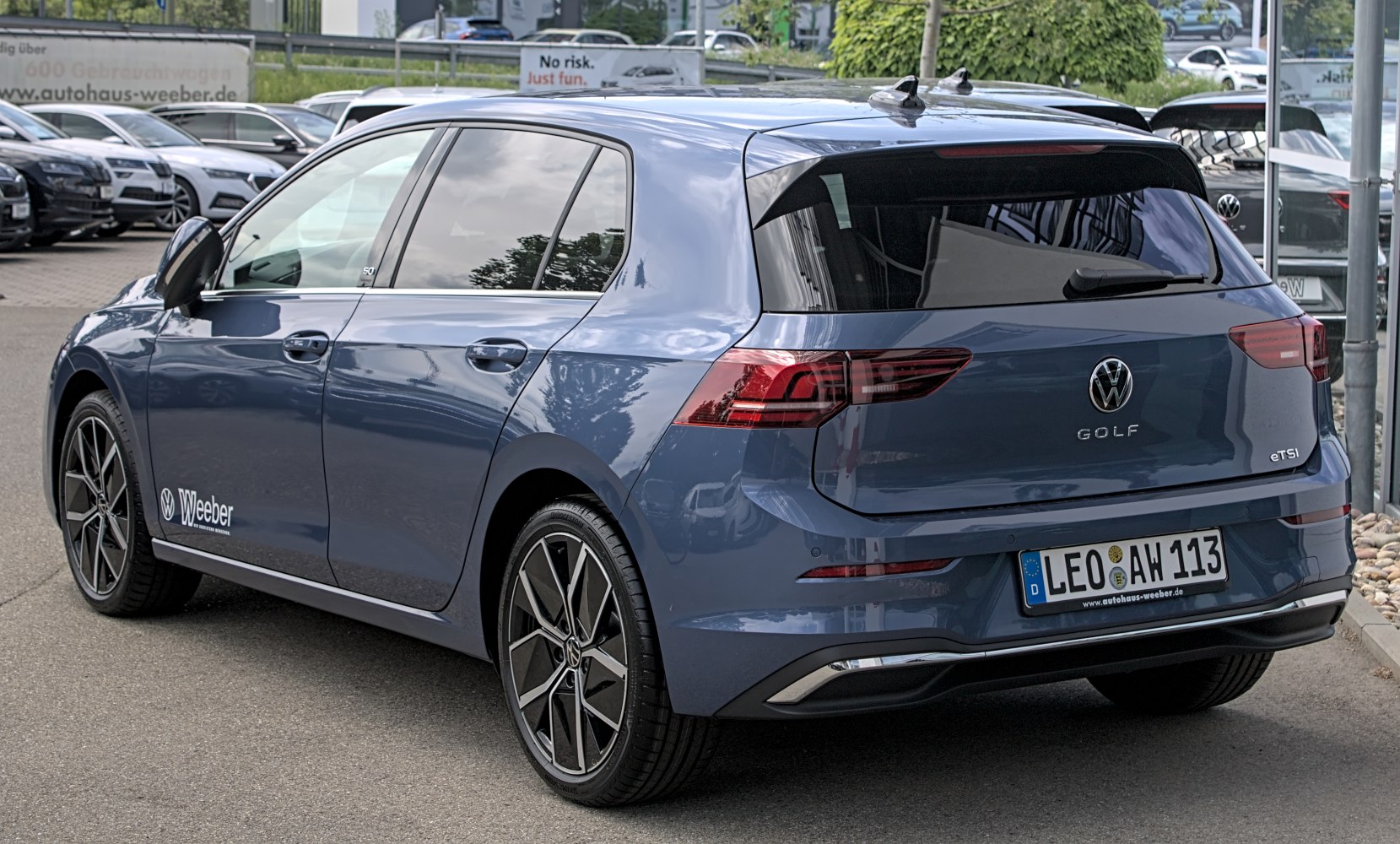 Rear view showcasing modern taillights and alloy wheels