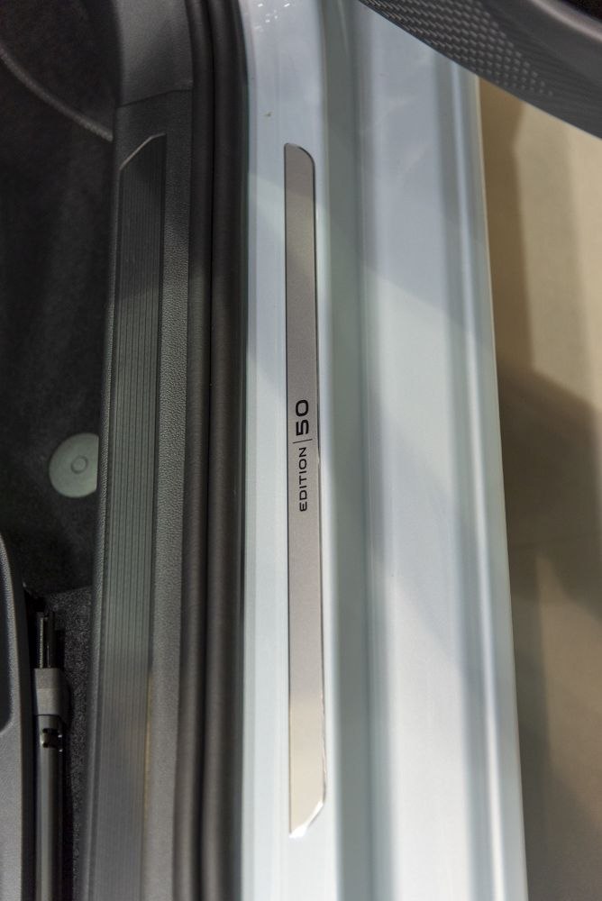 Close-up of door sill trim with Edition 50 engraving