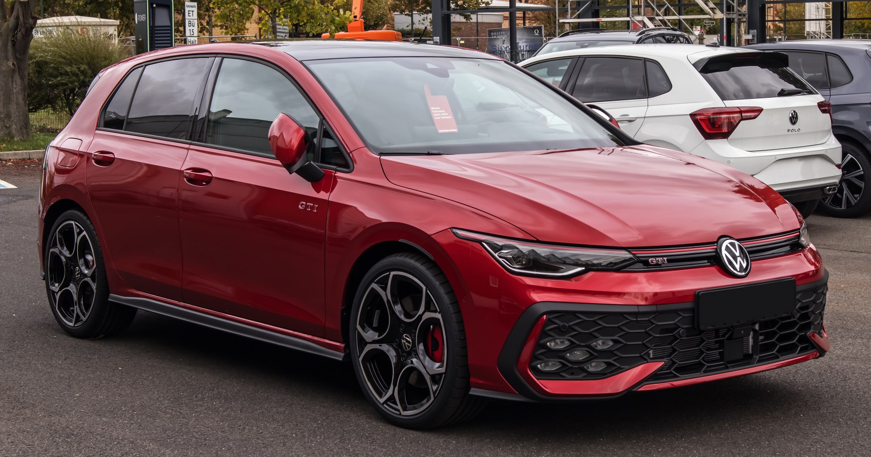 Red hatchback with honeycomb grille and LED headlights
