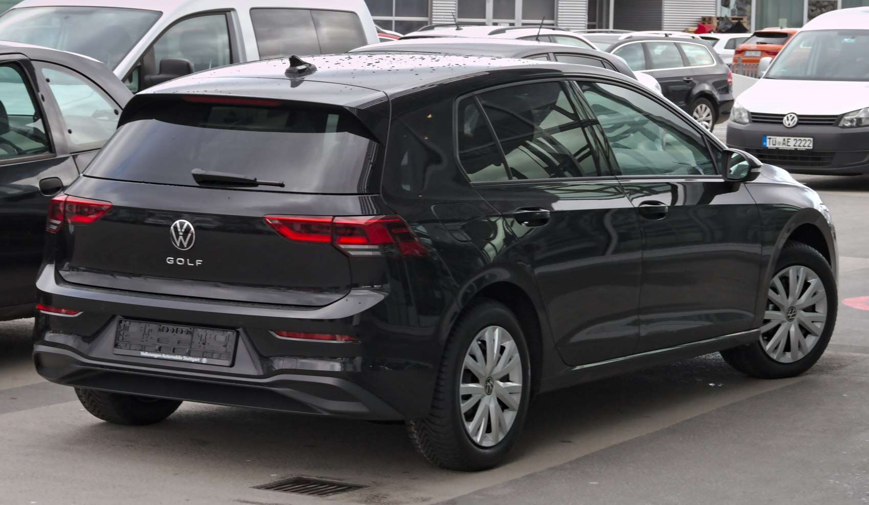 Rear angle of a black hatchback with distinctive taillights and smooth body lines