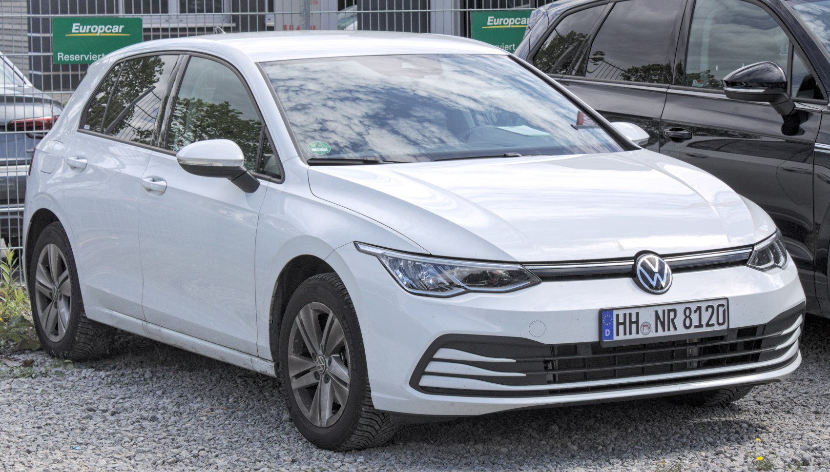 Front-angled view of hatchback with sharp headlights and modern grille