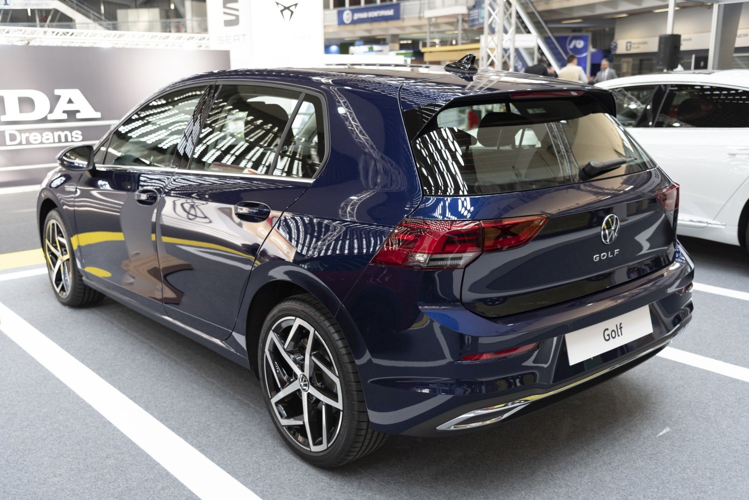Rear and side view of a sleek hatchback with modern taillights and alloy wheels