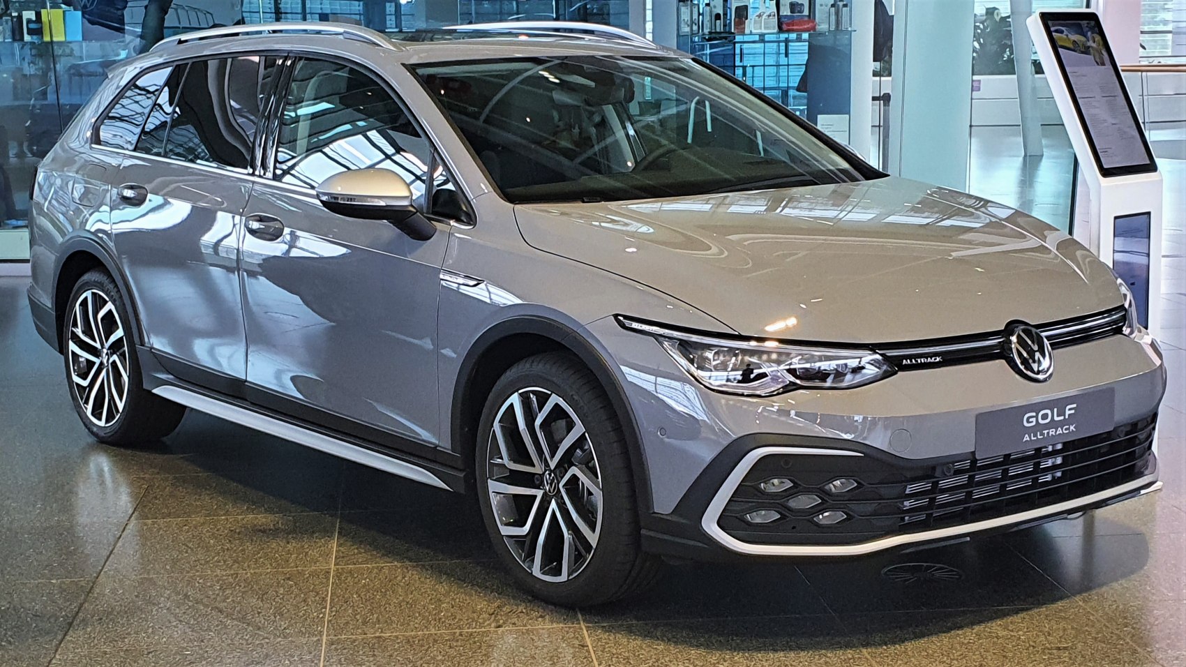 Front 3/4 view of station wagon with LED headlights and alloy wheels