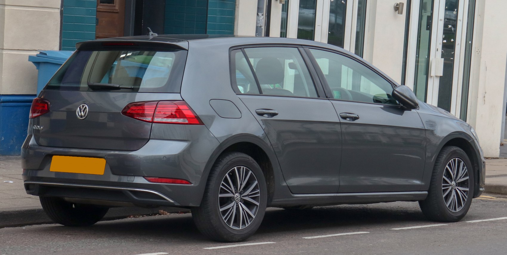 Rear and side profile of a 5-door hatchback with modern tail lights and alloy wheels