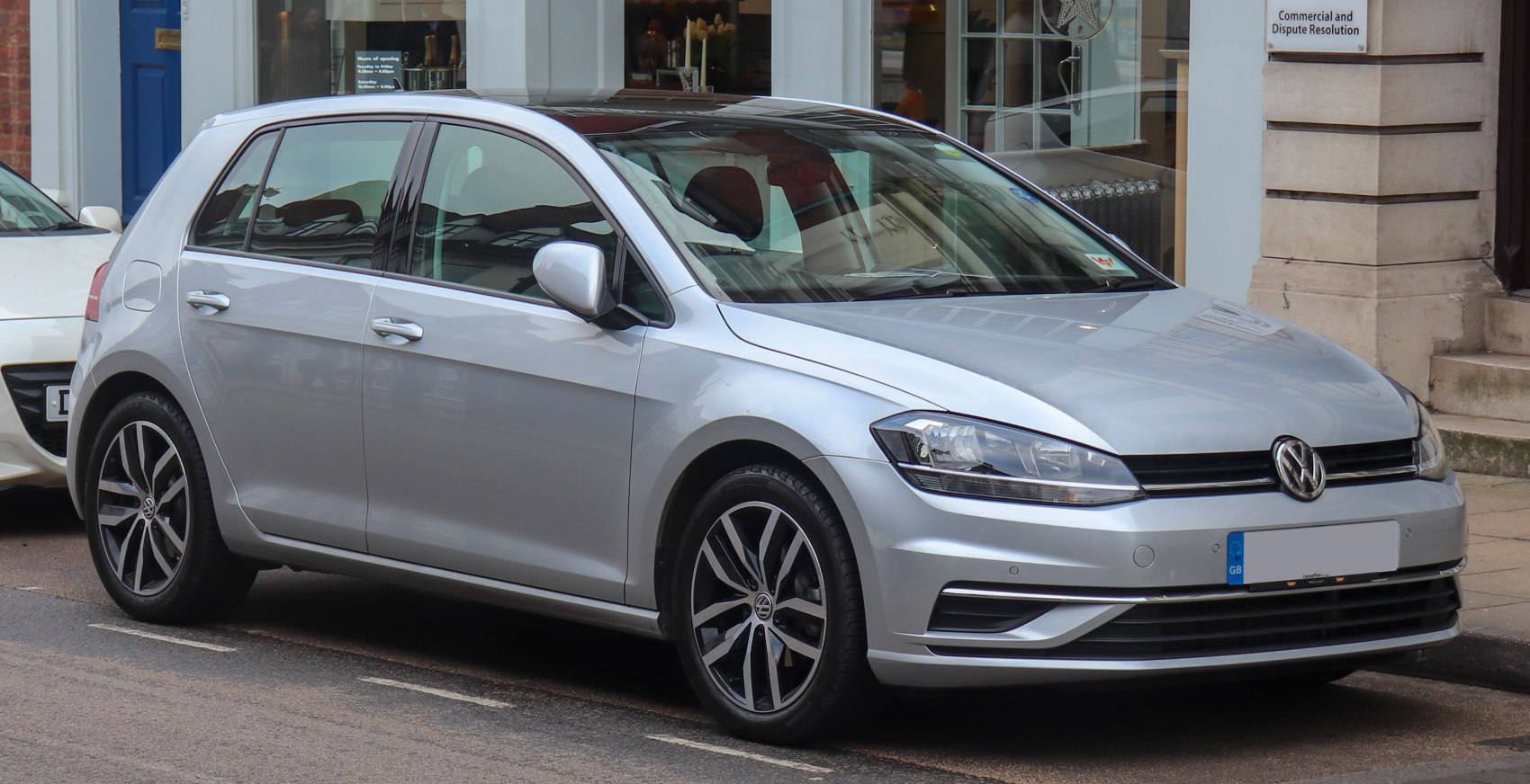 Silver 5-door hatchback with alloy wheels and modern headlights