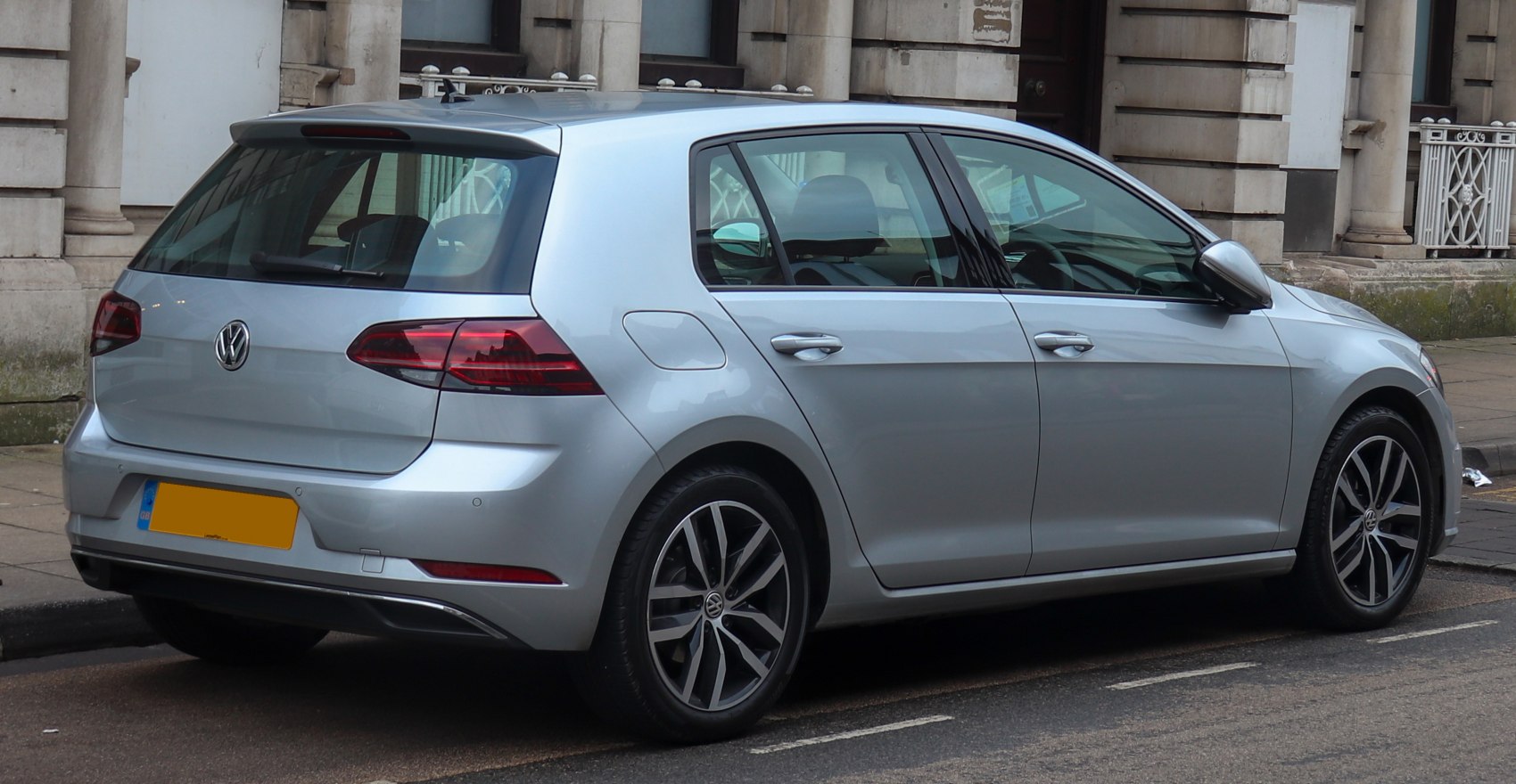 Rear side view of a 5-door hatchback with modern tail lights and alloy wheels