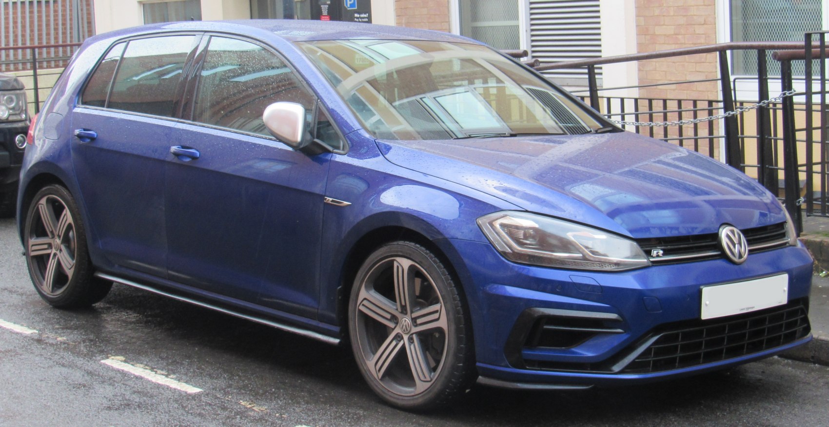 Blue hatchback with alloy wheels and modern headlights