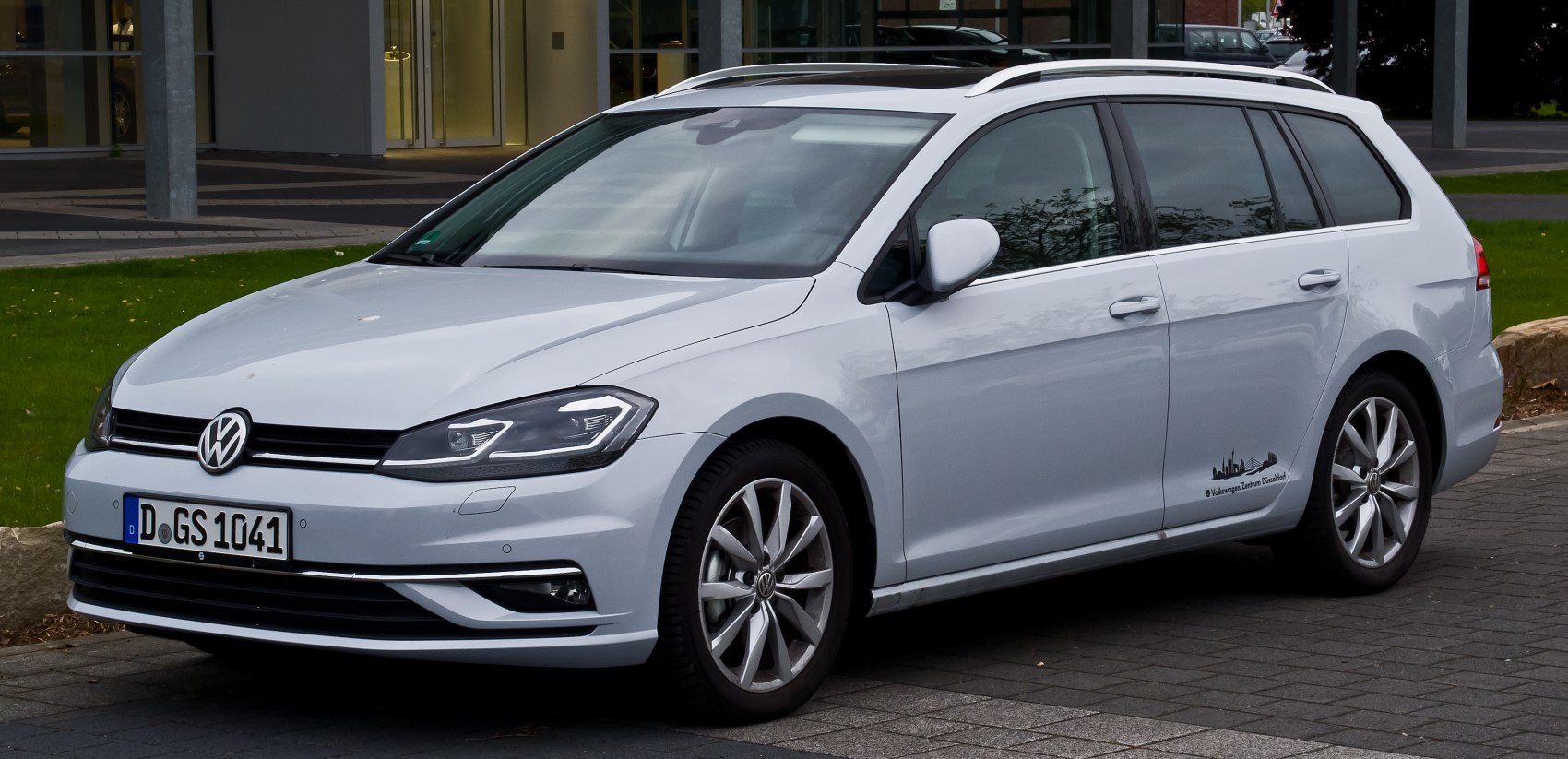 White station wagon with alloy wheels and roof rails