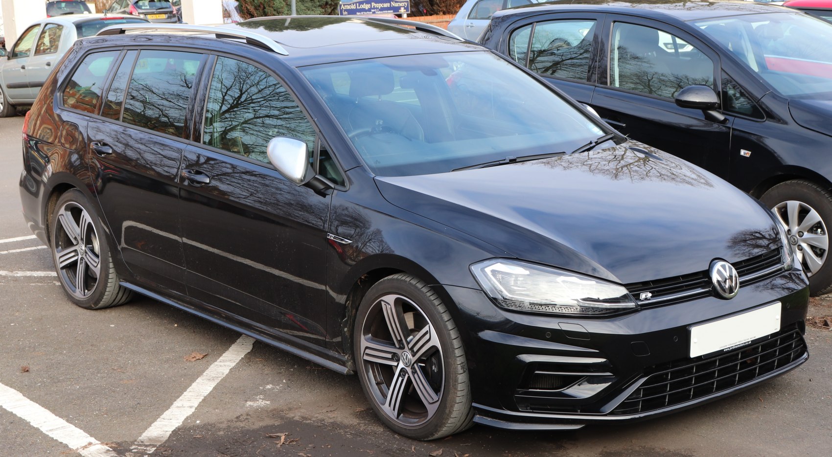 Black station wagon with sporty alloy wheels and LED headlights
