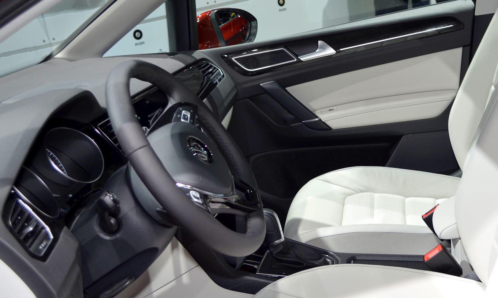 Modern steering wheel and light leather interior seating