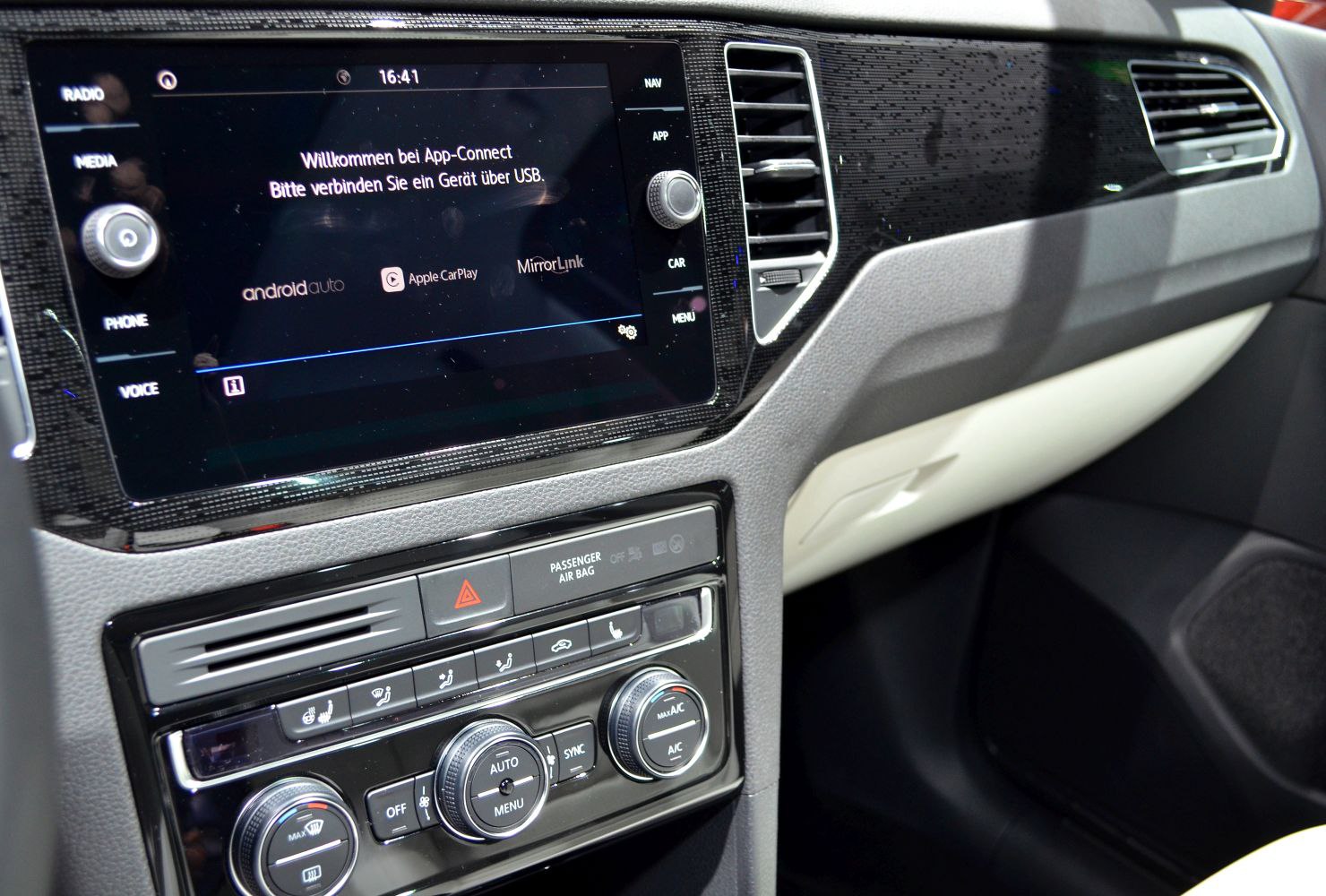 Touchscreen infotainment and climate control panel inside car