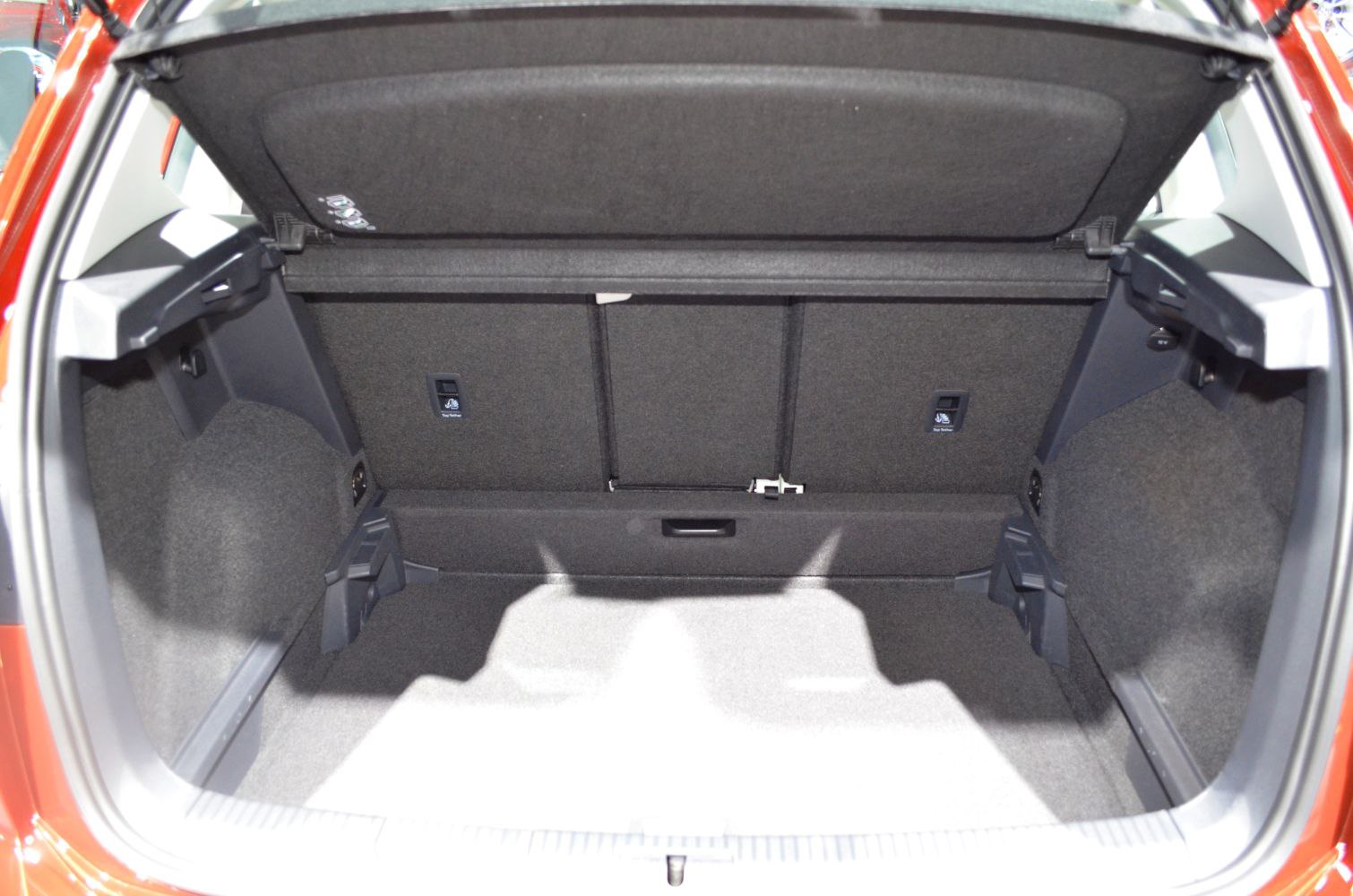 Spacious trunk interior with foldable rear seats and storage features.