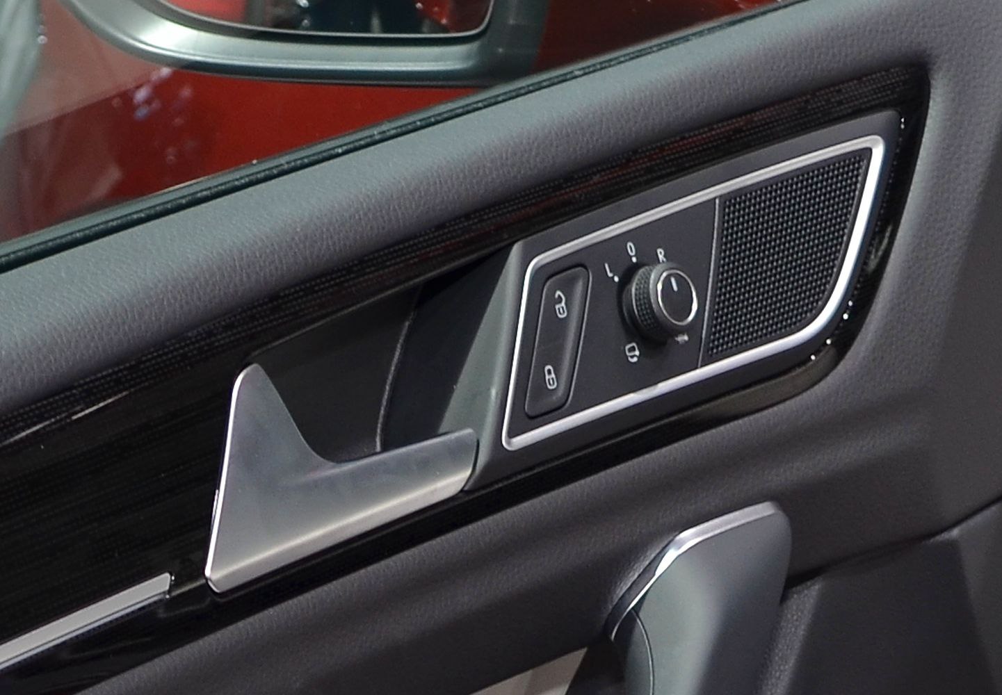Door interior controls including lock buttons and mirror adjustment knob