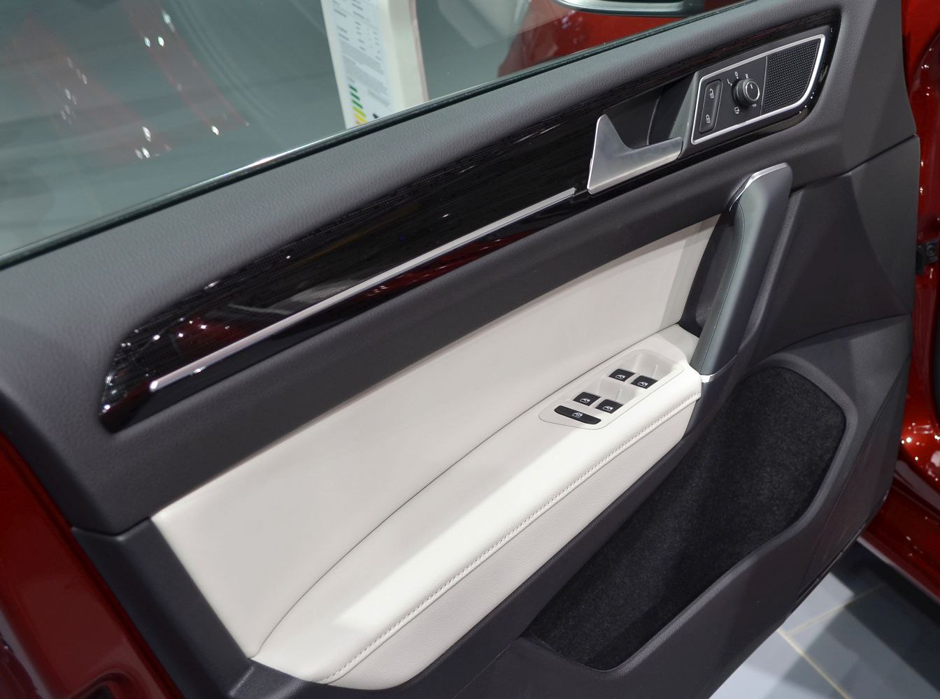 Front door panel with window controls and trim