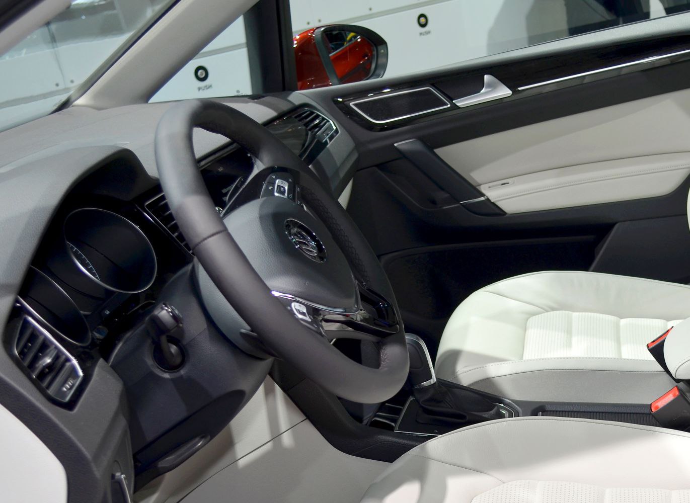 Steering wheel and front seat design with white leather upholstery