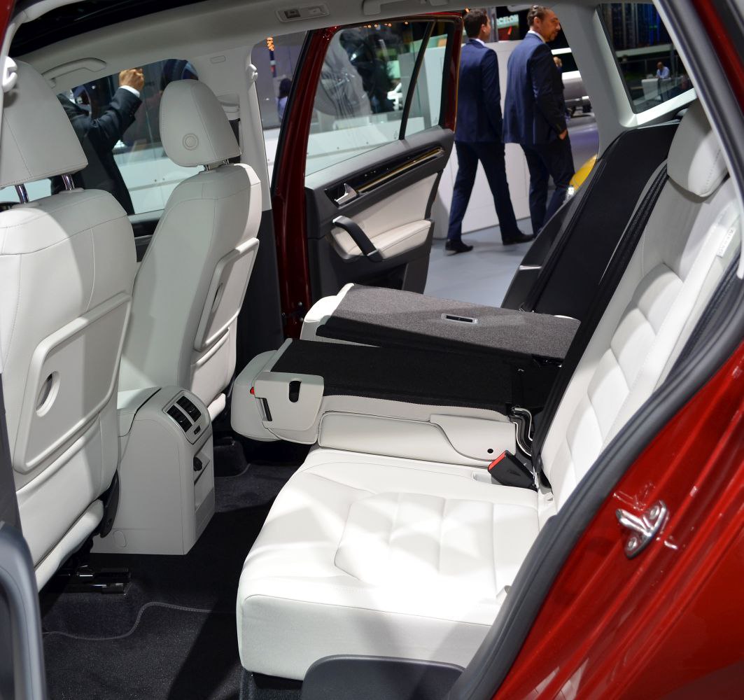 White leather rear seats with one folded down for extra cargo space