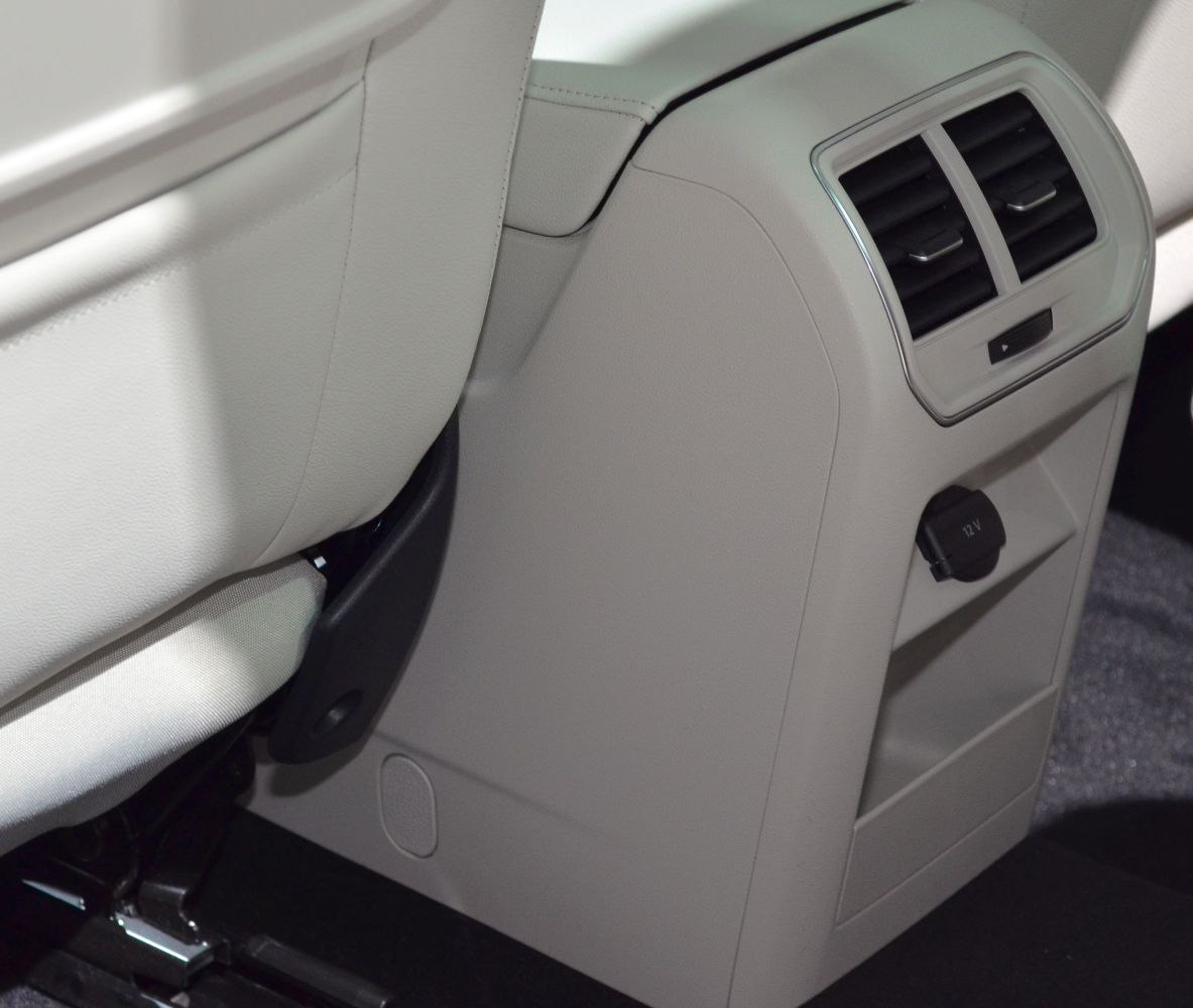 Rear seat ventilation vents and 12V power socket on car rear console