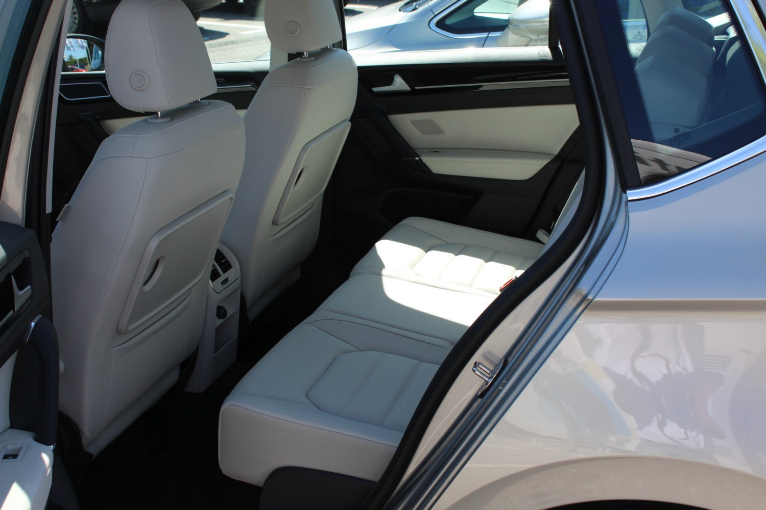 Spacious rear seating with modern design and light upholstery