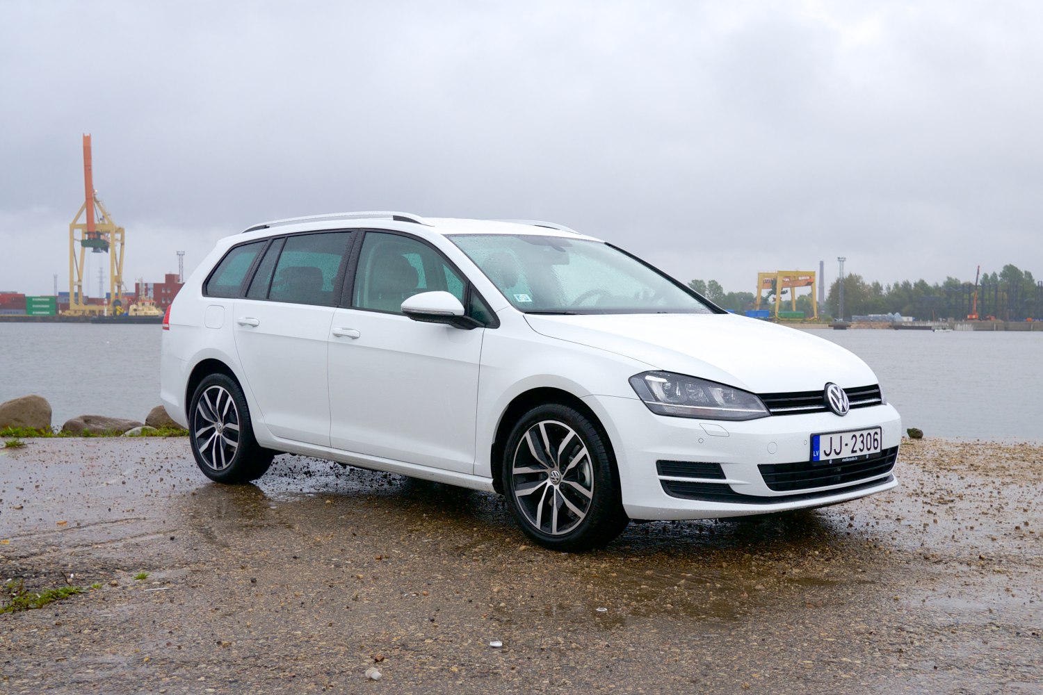 White station wagon with sporty wheels and sleek design