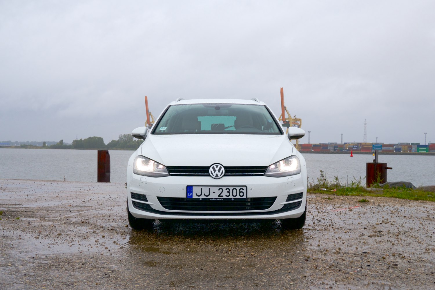 Front view with illuminated headlights and grille design