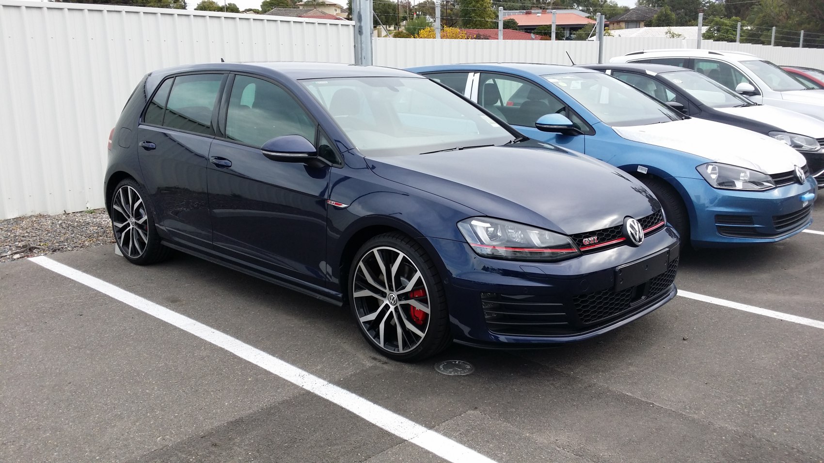 Sporty Volkswagen hatchback front-side view with alloy wheels.
