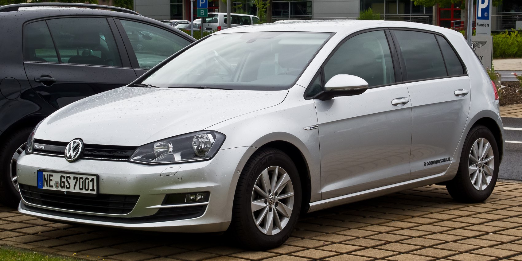 Silver 5-door hatchback with alloy wheels and front grille view